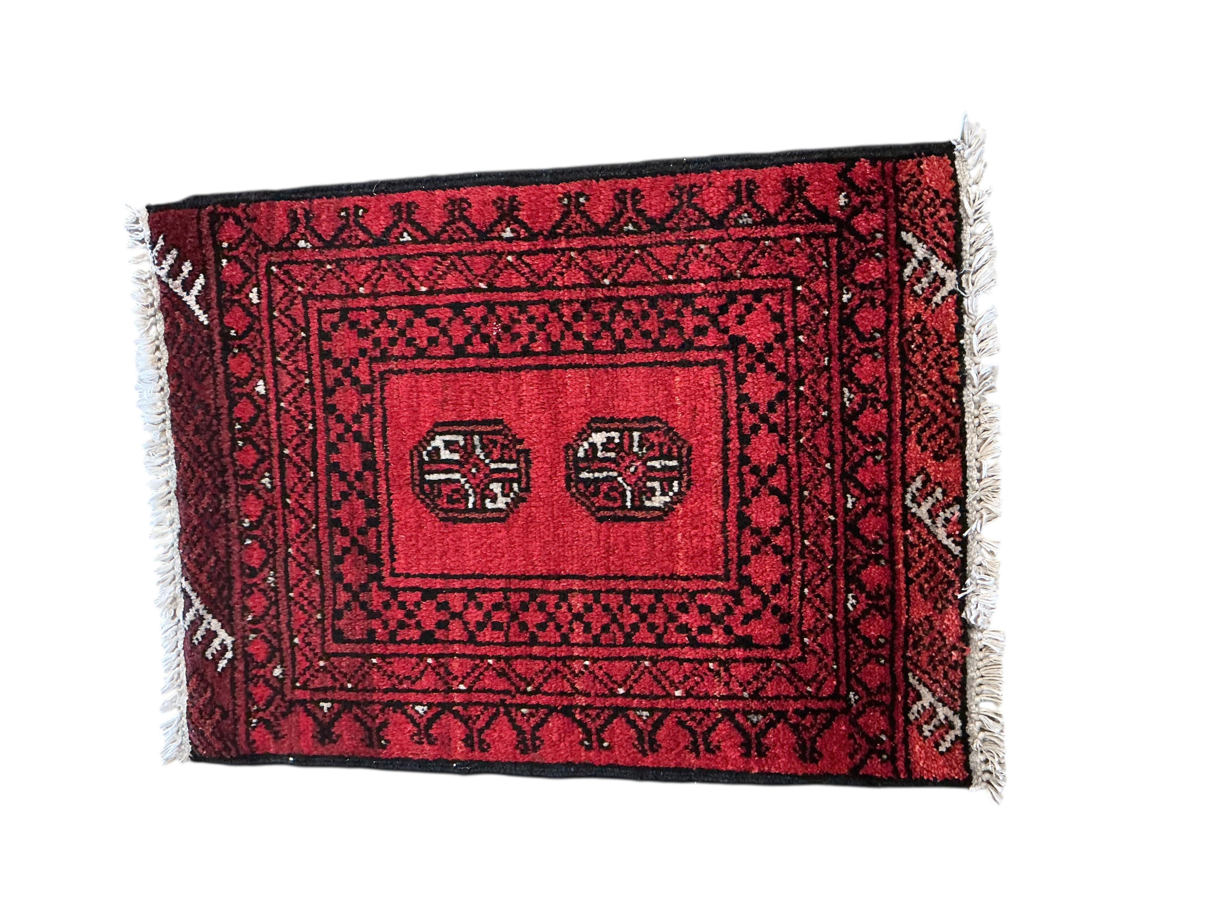 A Belouch rug, a Bokhara mat and a Caucasian style rug, largest 230 x 147cm